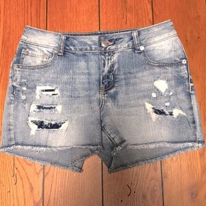 Maurices distressed, patched distressed denim cut off Jean shorts size 3/4